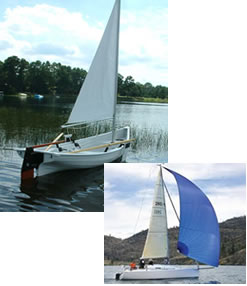 Two small sailboats on the water