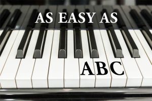 Piano keys with the words "As easy as ABC"
