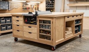 Mobile workbench with drawers, shelves and a table saw
