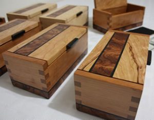 Wooden boxes with dovetail corners and a dark inlay on the lid