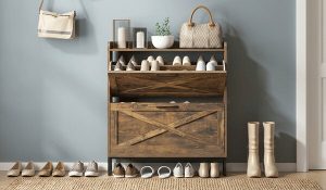 Wooden shoe rack with a barn-door cabinet in an entryway