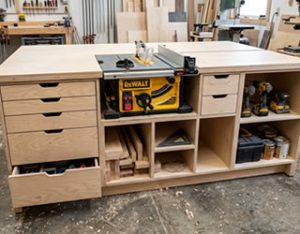 Workbench with drawers and a built-in table saw
